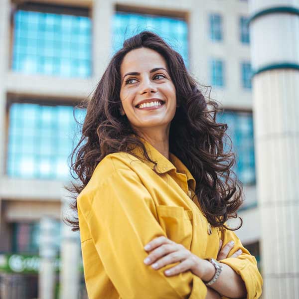 Portrait of a confident young woman standing in the city