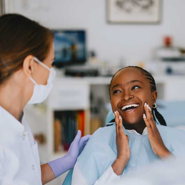 Happy Patient at Dental Clinic After Successful Checkup