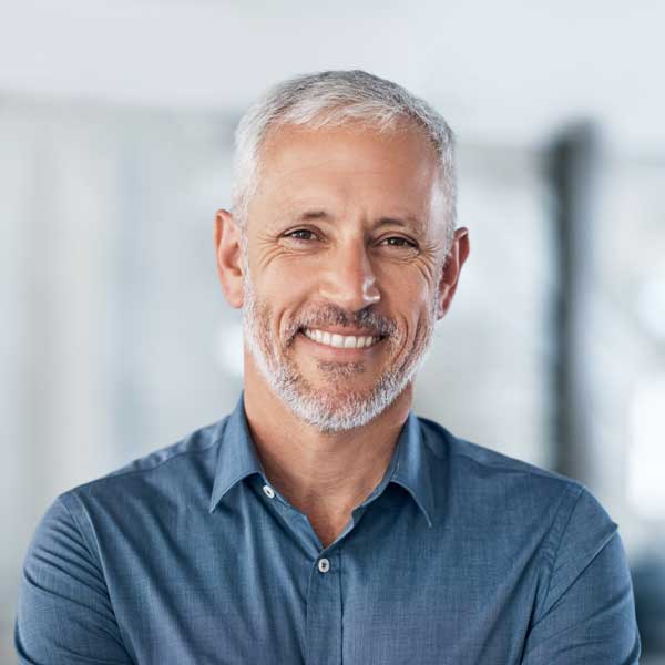 Portrait of a confident mature businessman working in a modern office